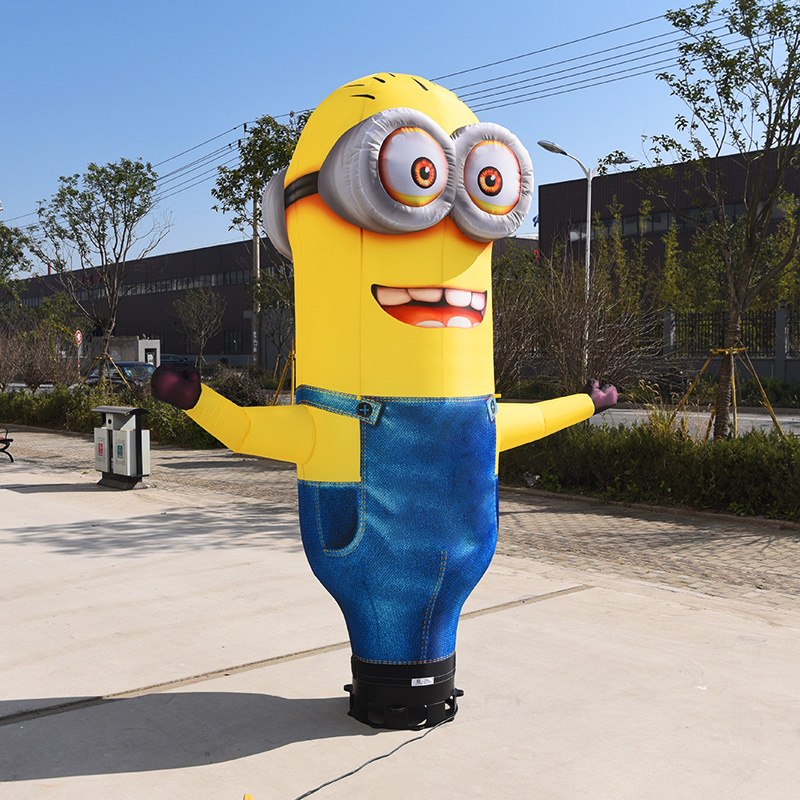 minion figurine with a fan inflatable dancing advertising man guy waving hand