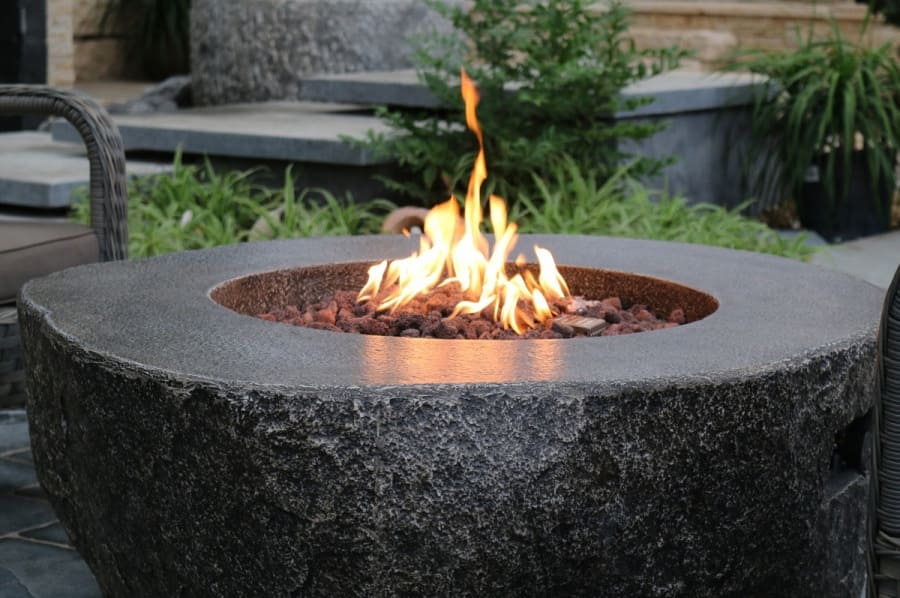 garden table with fireplace in the shape of stone gas fireplace