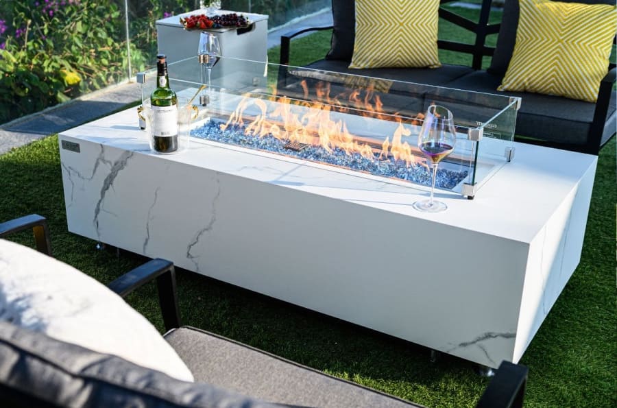 white table with a gas fireplace for the garden on the terrace